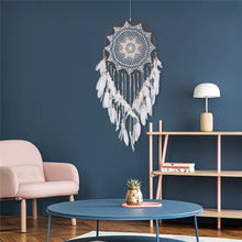 Load image into Gallery viewer, White dreamcatcher hanging on a blue wall in a living room