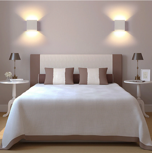 2 modern cube lights placed on the sides of the bed
