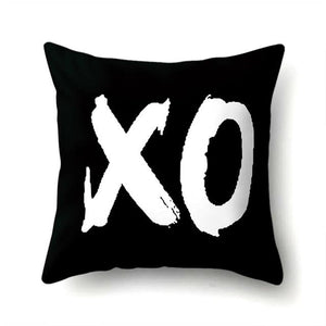 XO PRINTED IN WHITE ON A BLACK THROW CUSHION COVER