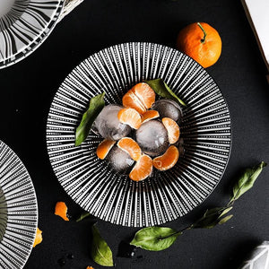 BLACK AND WHITE DEJAVU DEEP DISH WITH SEAFOOD PLACED ON A TABLE