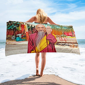girll with a beach towel on the beach