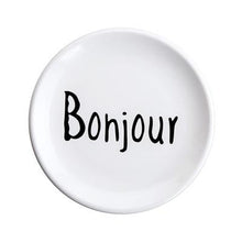 Load image into Gallery viewer, The word bonjour printed in black on a white ceramic plate