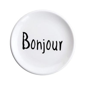 The word bonjour printed in black on a white ceramic plate