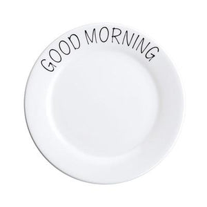 Good morning printed in black on a white ceramic plate