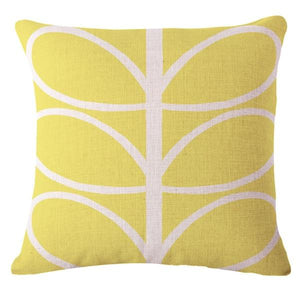 Funky yellow cushion cover with white abstract leaves