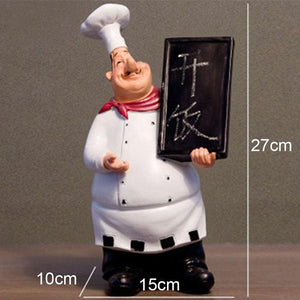 1 chef figurine statue with a small board displaying dimensions 