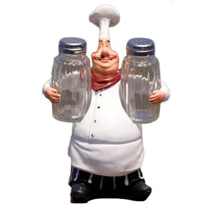 1 chef figurine statue holding a salt and pepper shaker