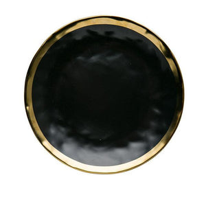 karma dinnerware plate in black with gold lining