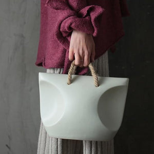 lady holding a luna plant pot