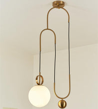 Load image into Gallery viewer, Madorne pendant light with gold plated ball mounted on a ceiling