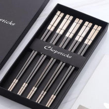 Load image into Gallery viewer, 5 pairs of grey and off white chopsticks in a black box