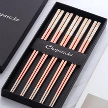 Load image into Gallery viewer, 5 pairs of rose gold with white colored ends chopsticks in a black box