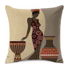 Load image into Gallery viewer, african lady posing near a drum and a large water jar printed on a cushion cover