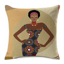 Load image into Gallery viewer, african lady posing in a black dress with designs printed on a cushion cover