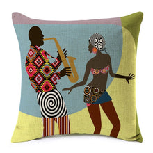 Load image into Gallery viewer, cushion cover with an image printed of an african girl dancing near a man playing the trumpet