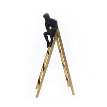Load image into Gallery viewer, decorative figurine of a man statue sitting on a gold rectangular tower
