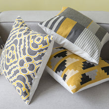 Load image into Gallery viewer, 3 cushion covers in different abstract designs placed on a couch