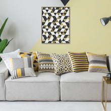 Load image into Gallery viewer, cushion cover with grey, mustard yellow, black and white in geometrical stripes placed on a couch