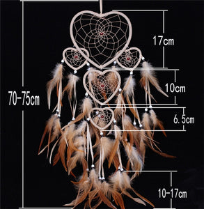 brown feathers on a dreamcatcher with white heart shaped rings and size specifications