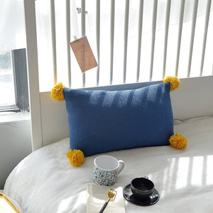 blue cushion with yellow tassels on all four ends FunkChez