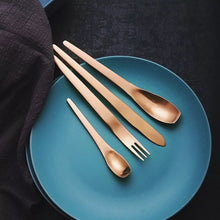 Load image into Gallery viewer, 4 piece cutlery set in ombre colour placed on a blue plate