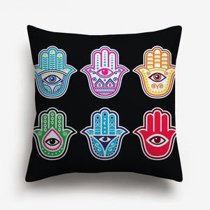 6 hands with eyes in different colours printed on a cushion cover