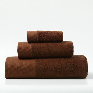 set of 3 luxury towels in different sizes in rust brown colour