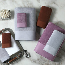 Load image into Gallery viewer, set of luxury towels in different sizes and colours of grey, rust brown and lilac stacked