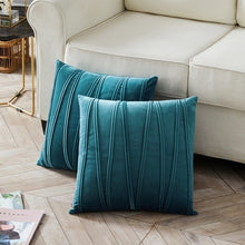 Load image into Gallery viewer, 2 cushions in blue from the Nordane cushion collection placed besides a couch