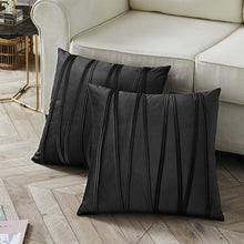 Load image into Gallery viewer, 2 cushions in black from the Nordane cushion collection placed besides a couch