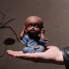 Load image into Gallery viewer, hand holding a baby figurine expressing hear no evil