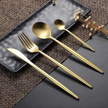 Load image into Gallery viewer, Classy Ains Gold-plated cutlery set with large and small sized spoons, fork and knife resting on a plate