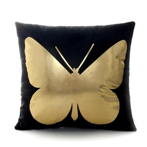 gold butterfly image printed on a black throw cover