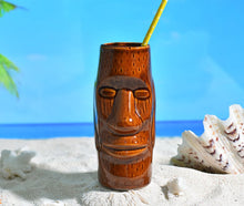 Load image into Gallery viewer, tiki tumbler lying in the sand on the beach