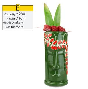 green with abstract design ceramic tiki mug filled with a cocktail and some veggies and size specifications