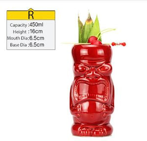 red ceramic tiki mug filled with a cocktail and some veggies and size specifications